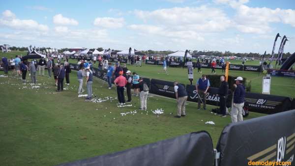 Golfers demo Titleist Golf clubs and balls